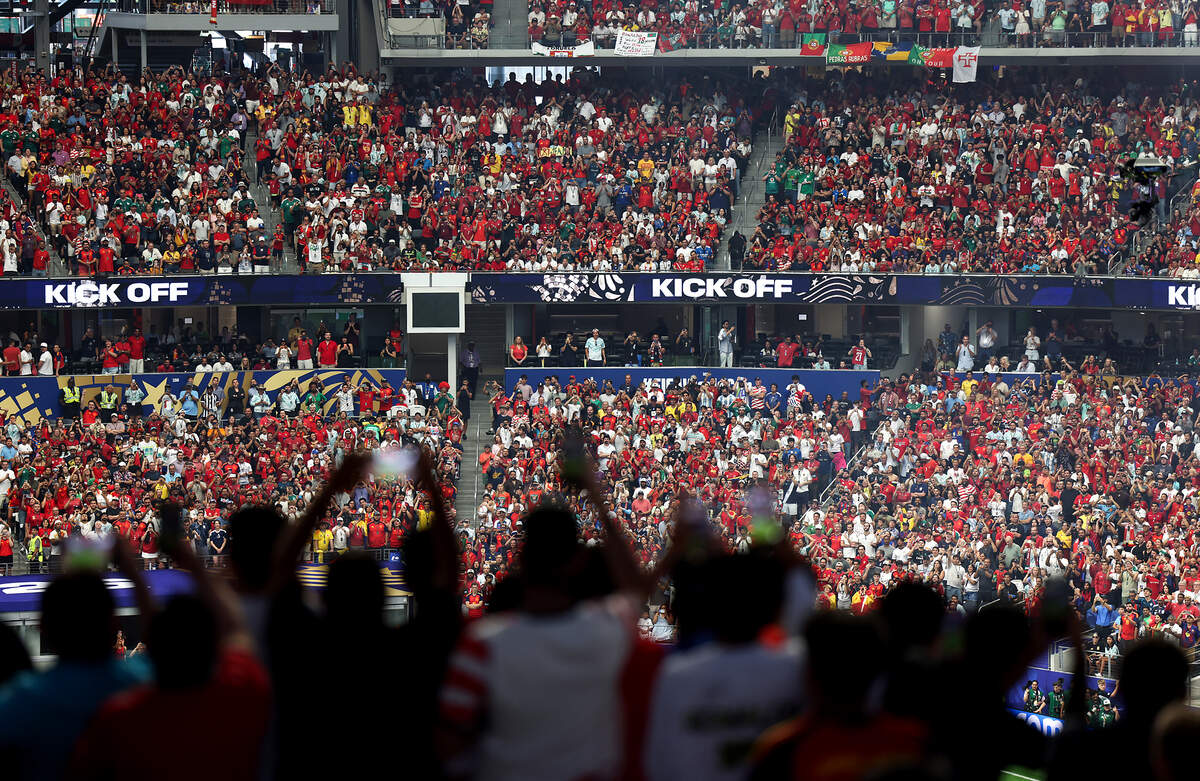 A full Dallas Stadium erupts into cheers as the Portugal and Spain teams take the field in the 2026 FIFA World Cup round of 16 match on Monday, July 6, 2026, at Dallas Stadium in Arlington.